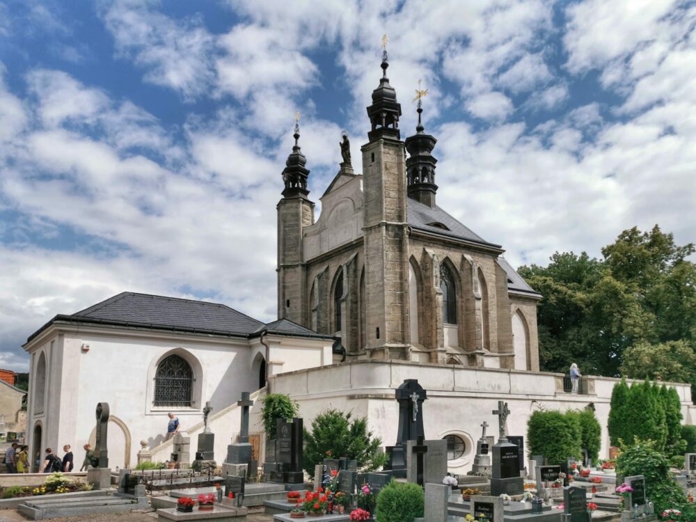 a church with a cemetery in front of it