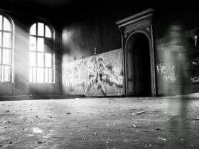 grayscale photo of person standing inside building