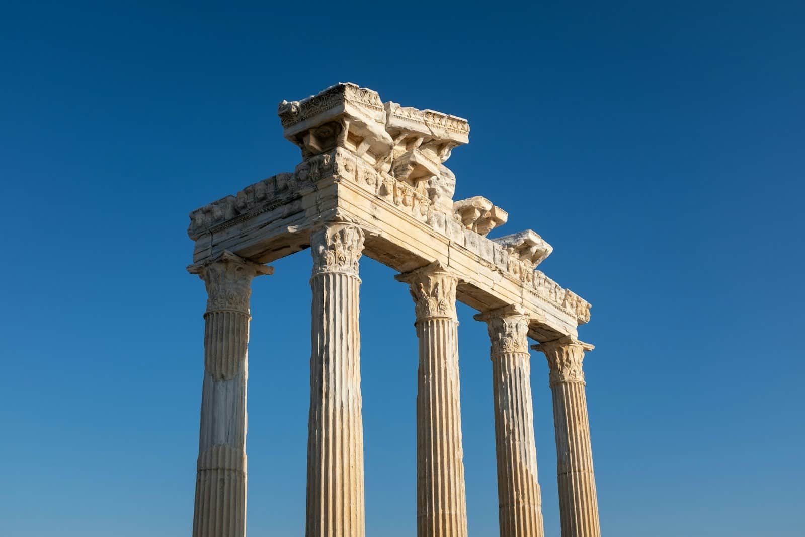 a tall stone structure with four pillars